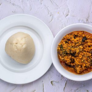 Egusi soup served with pounded yam.