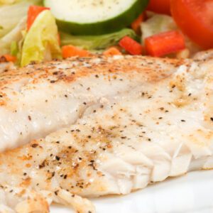 Healthy meal with fish and greens